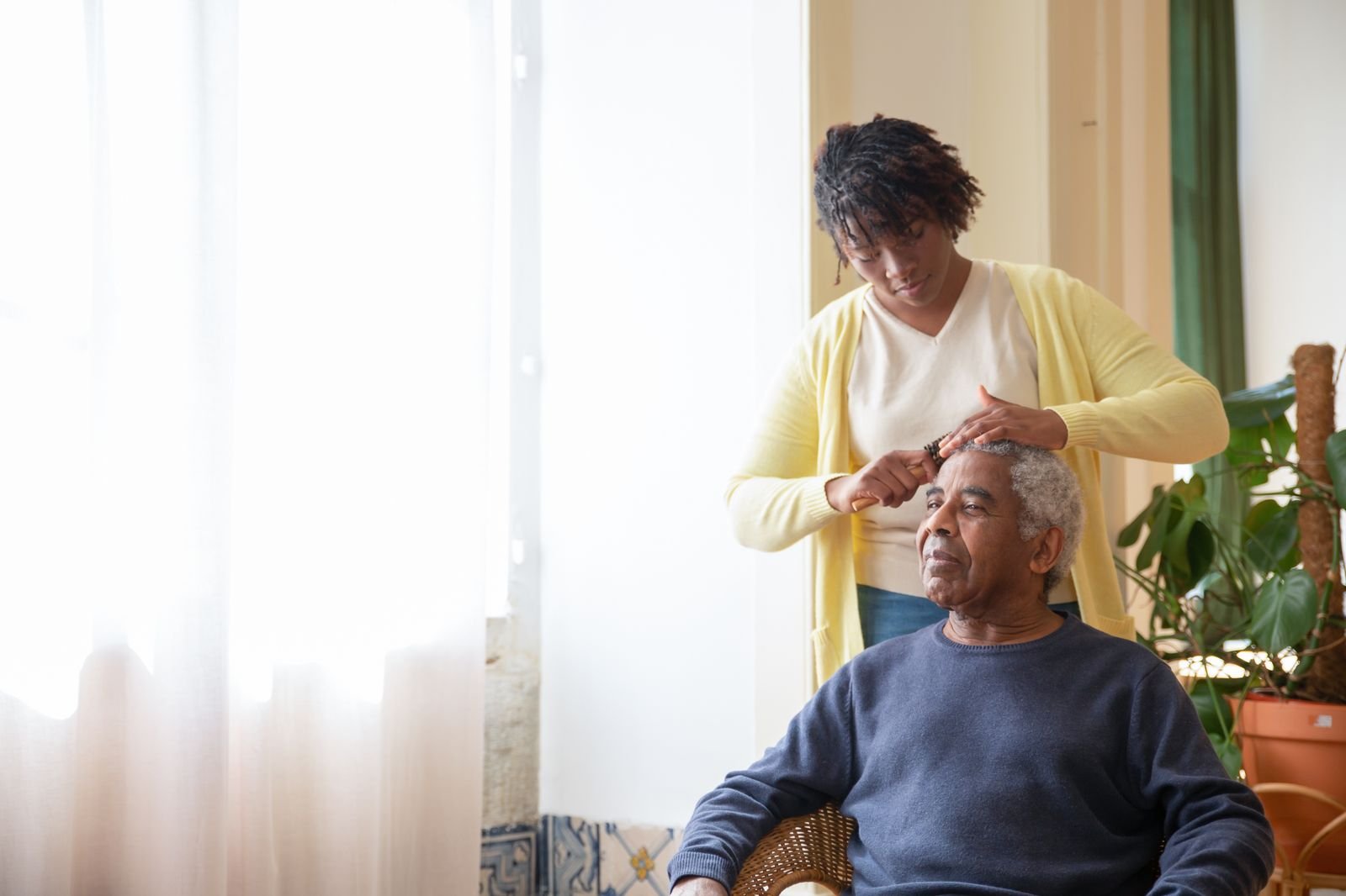 Aquarius carer helping a client at home