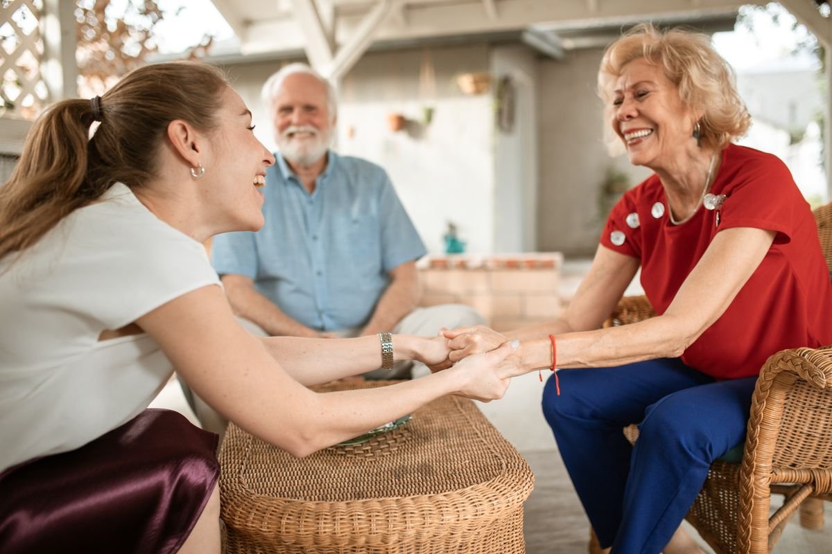 Family speaking with an Aquarius carer